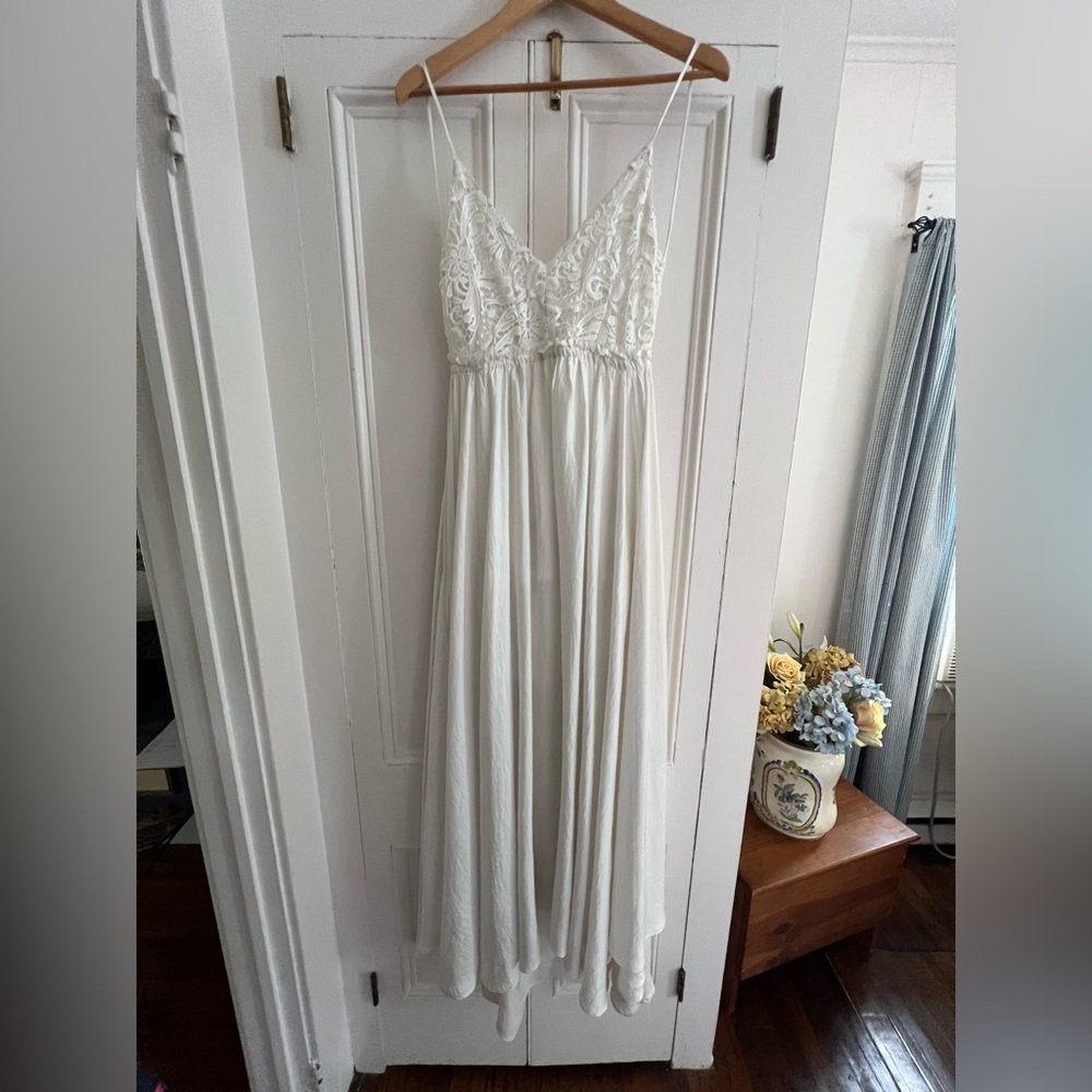 Lace on top, long beautiful dress, hangs low in the back.